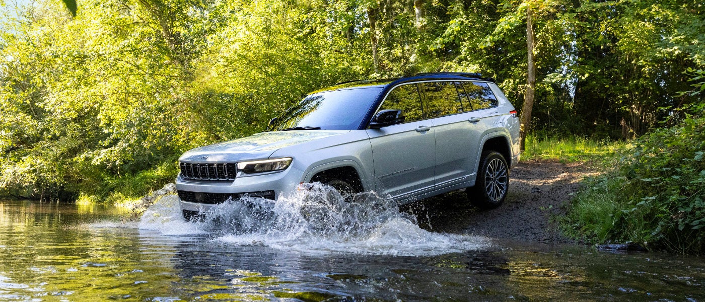 2026 Jeep Cherokee driving in a stream
