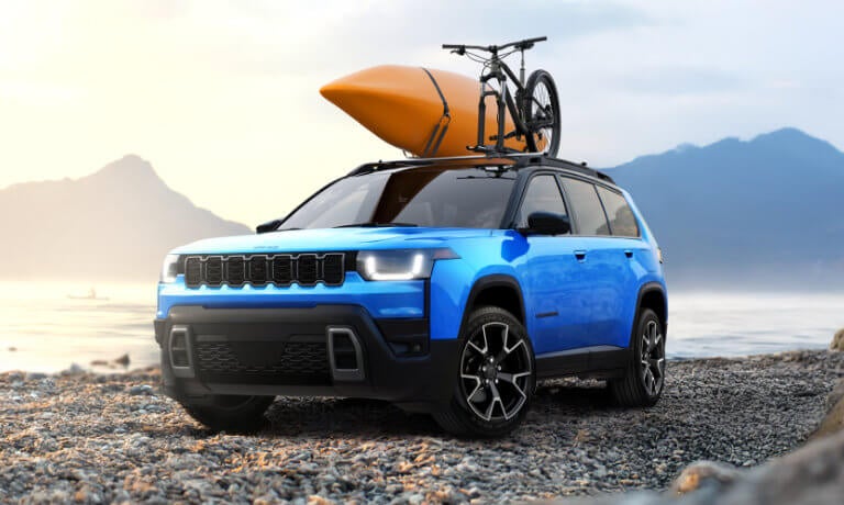 2026 Jeep Cherokee on beach with kayak