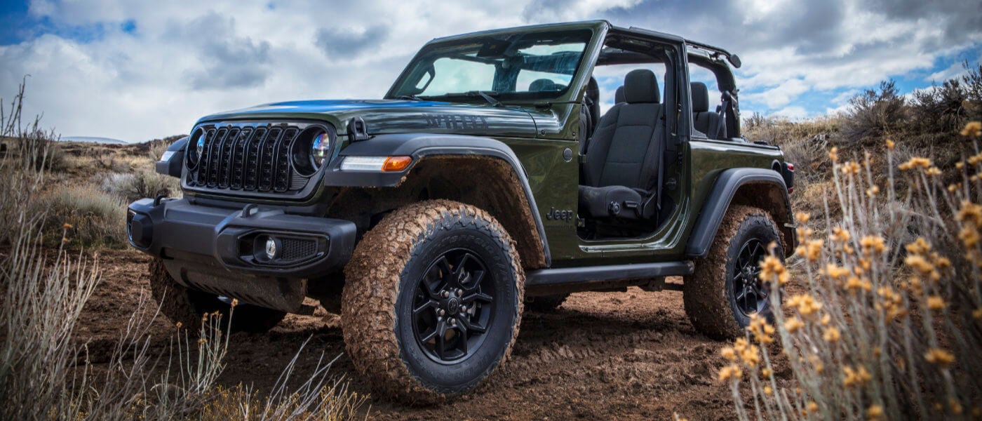 2026 Jeep Wrangler with doors off in field