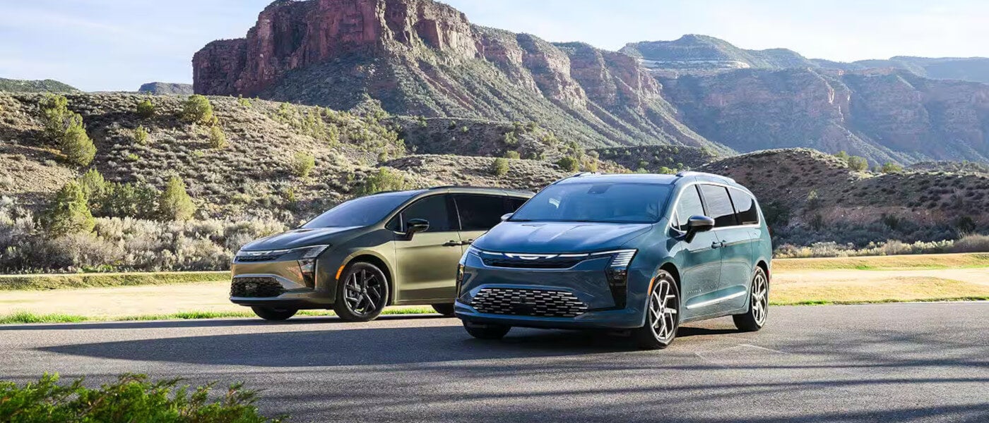 2027 Chrysler Pacifica pair parked in mountains